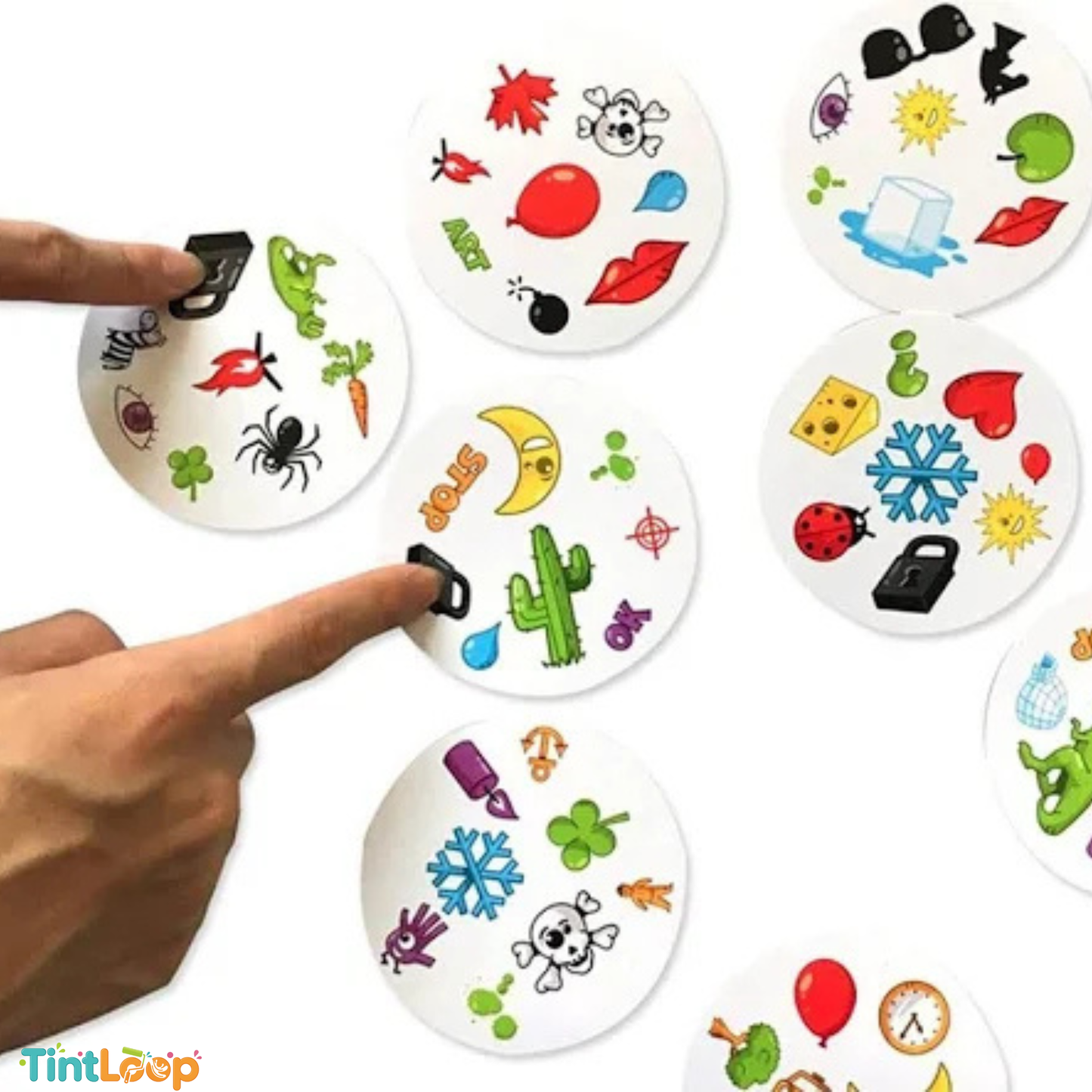 A close-up of a hand pointing at circular white cards printed with colorful temporary tattoo designs, including leaves, spiders, snakes, hearts, and geometric symbols. The TintLoop logo appears in the bottom-left corner.
